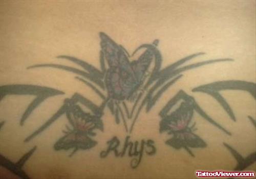 Black Ink Tribal And Butterfly Tattoo On Upperback