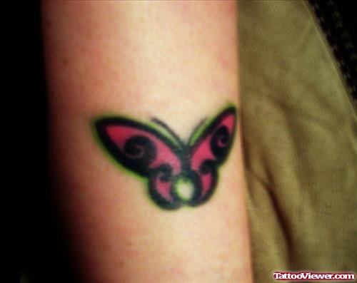 Black And Red Ink Butterfly Tattoo On Bicep
