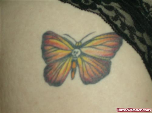 Yellow Ink Butterfly Tattoo On Hip