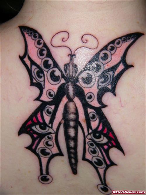 Colored Tribal Butterfly Tattoo On Upperback