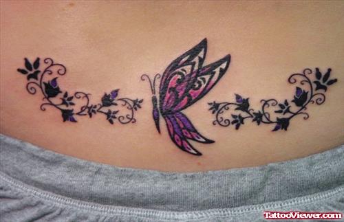 Colored Butterfly And Flowers Tattoo