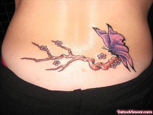 Butterfly On Tree Color Ink Tattoo On Lowerback