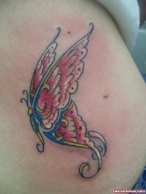 Blue and Red Ink Butterfly Tattoo On Hip