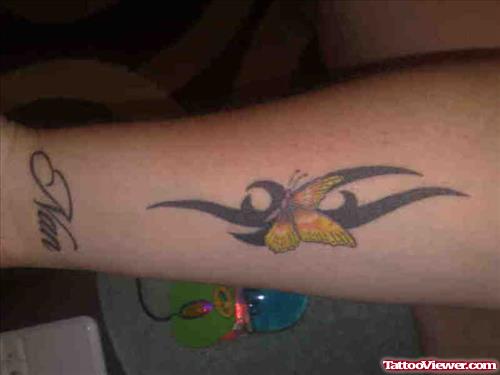 Black Tribal And Butterfly Tattoo On Left Arm