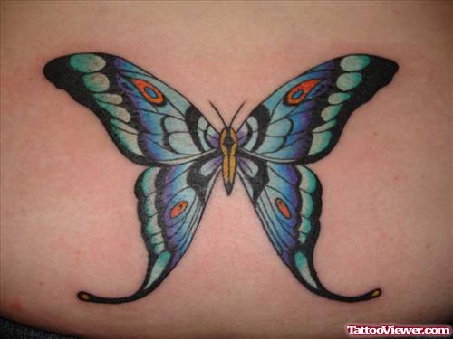 Awesome Colored Ink Butterfly Tattoo On Lowerback