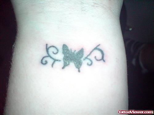 Tribal And Butterfly Tattoo On Wrist