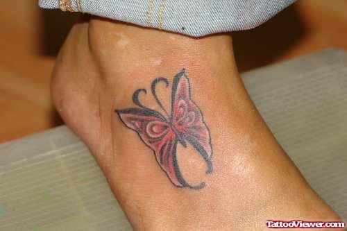 Red Ink Butterfly Tattoo On Right Foot