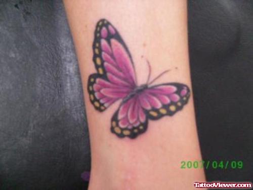 Pink Butterfly Tattoo On Leg