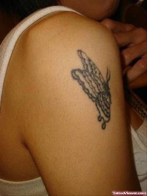 Grey Ink Butterfly Tattoo On Right Shoulder