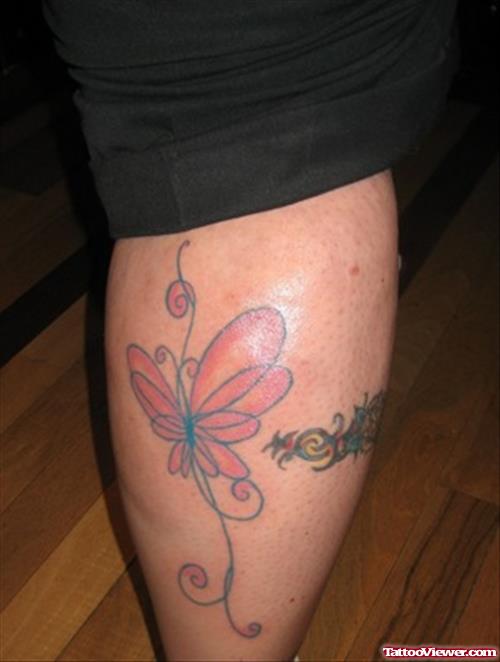 Colored Butterfly Tattoo On Back Leg