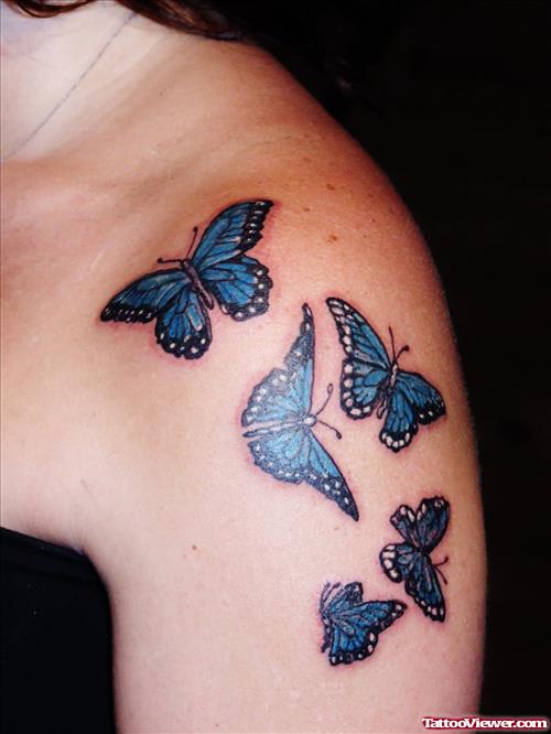 Blue Ink Butterfly Tattoo On Left Shoulder