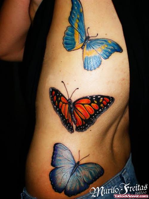 Blue And Red Butterflies Tattoos On Side Rib