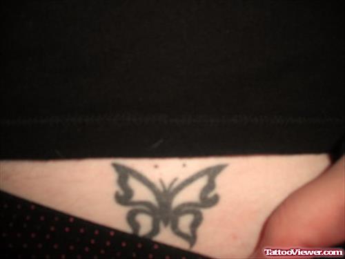 Black Ink Tribal Butterfly Tattoo On Lowerback