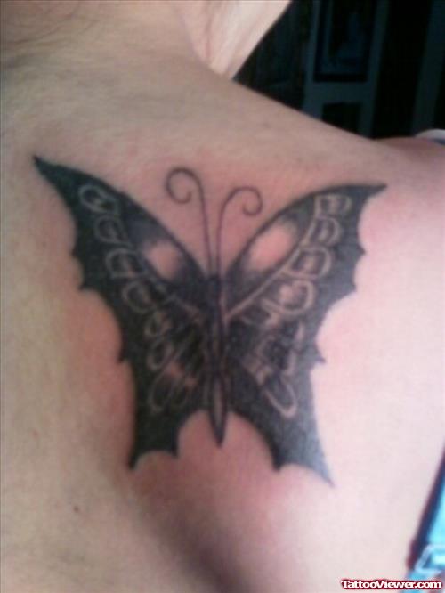 Black Ink Butterfly Tattoo On Right Back Shoulder