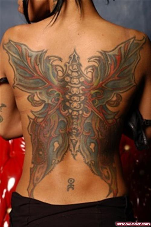 Awesome Colored Butterfly Tattoo On Girl Back
