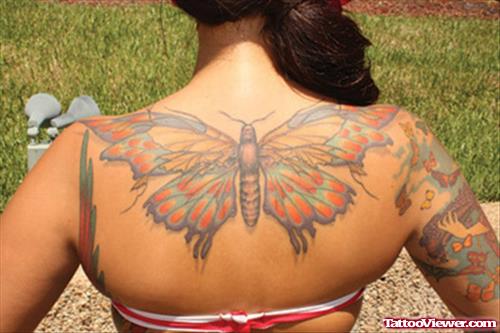Unique Colored Butterfly Tattoo On Girl Upperback