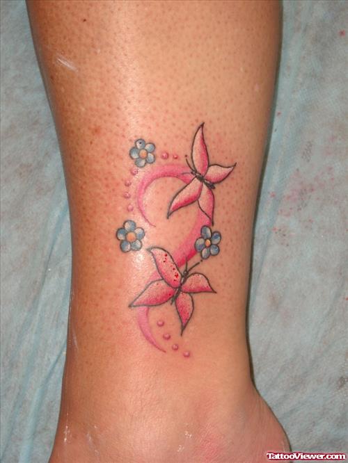 Pink Butterflies And Blue Ink Flowers Tattoos On Leg