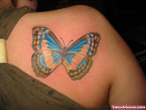 Awful Blue Ink Butterfly Tattoo On Right Back Shoulder