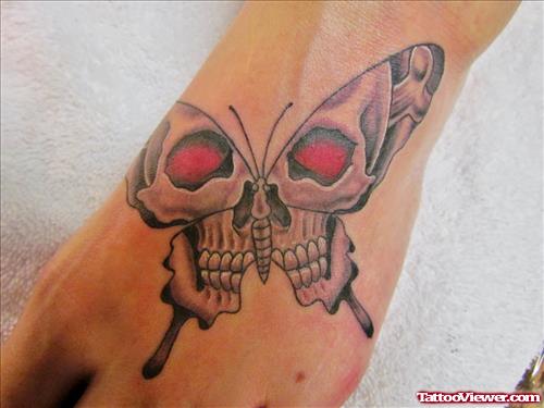 Red Eyes Slulls Butterfly Tattoo On Left Foot