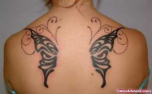 Black Ink Tribal Butterfly Wings Tattoos On Upperback