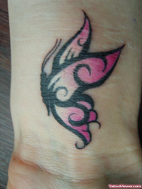 Black And Pink Butterfly Tattoo On Wrist