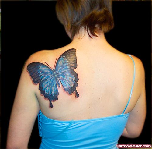 Black And Blue Ink Butterfly Tattoo On Left BAck SHoulder