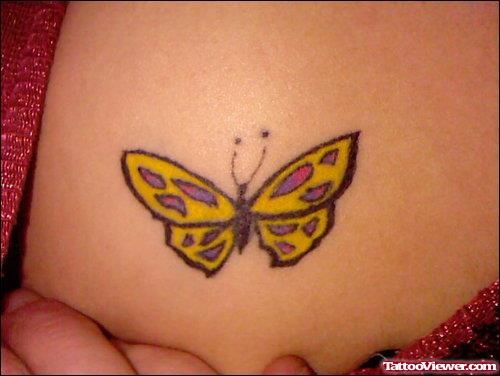 Yellow Butterfly Tattoo On Chest