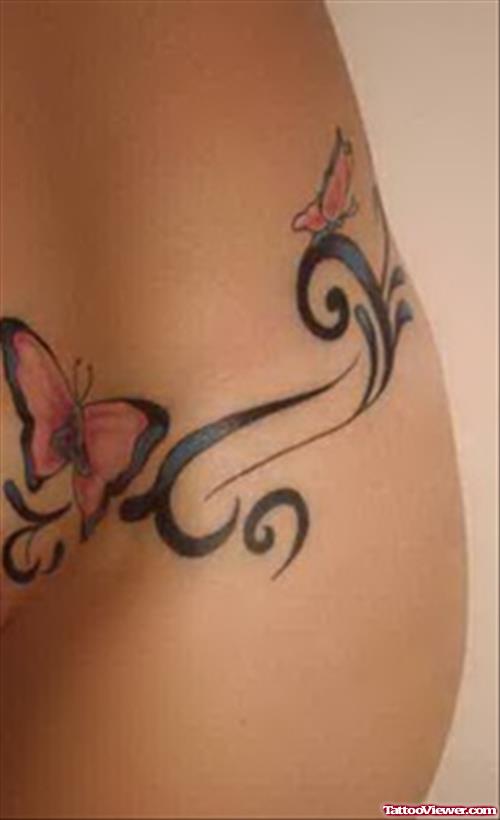 Tribal And Butterfly Tattoo On Hip