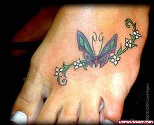 Tiny Flower And Butterfly Tattoo On Left Foot