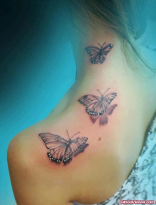 Grey Ink Flying Butterfly Tattoo On Upperback