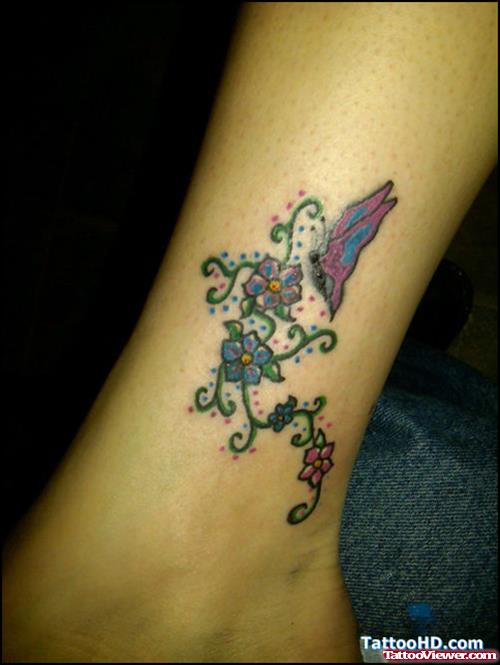 Colored Flowers And Butterfly Tattoo On Leg