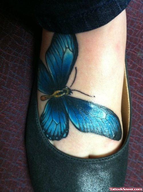 Blue Ink Butterfly Tattoo On Right Foot