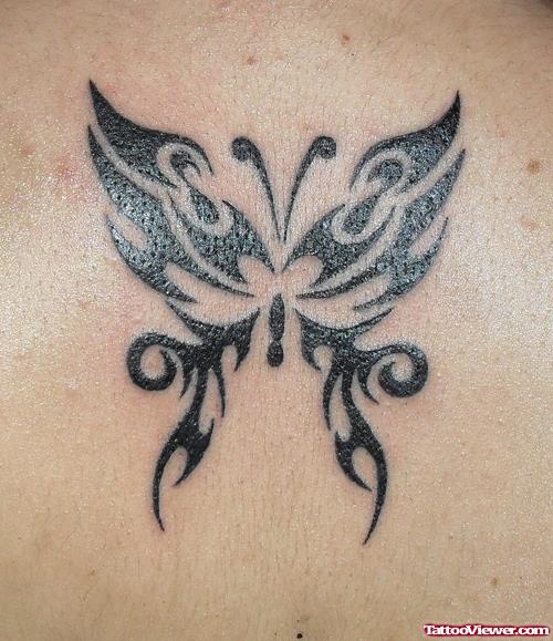 Attractive Black Ink Tribal Butterfly Tattoo
