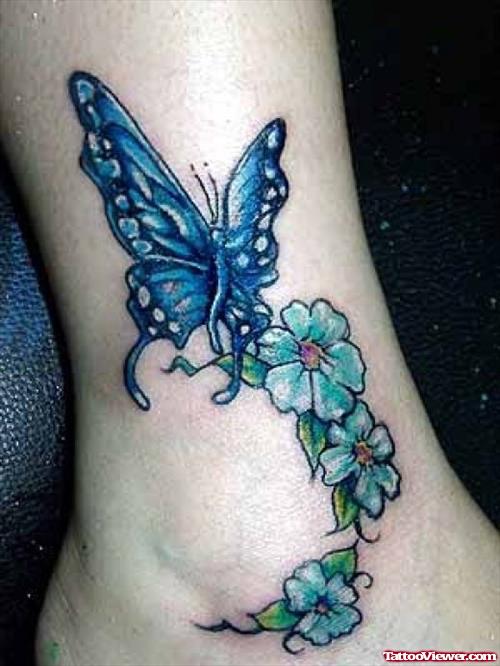 Blue Flowers And Butterfly Tattoo On Ankle