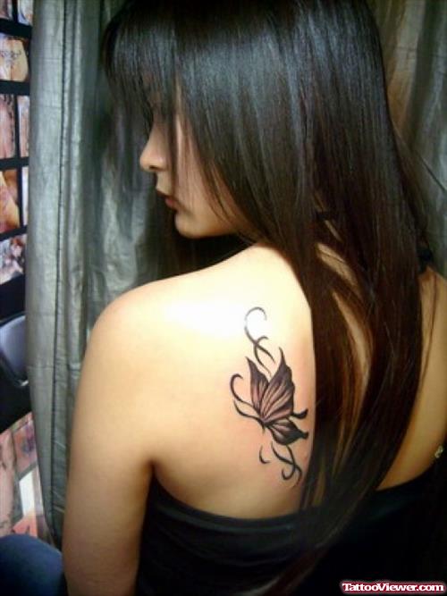 Grey Ink Butterfly Tattoo On Girl Left Back Shoulder
