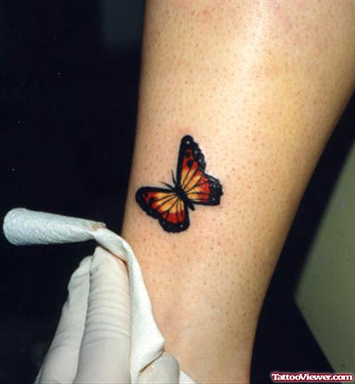Colored Butterfly Tattoo On Leg