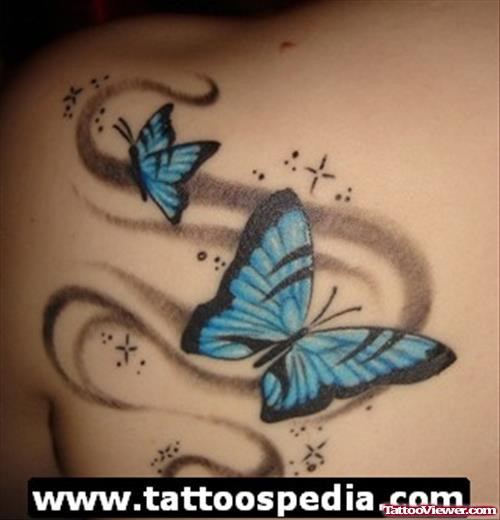 Blue Ink Butterfly Tattoos On Left Back Shoulder