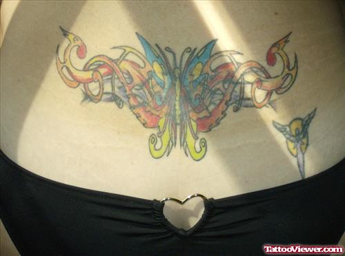 Tribal And Colored Butterfly Tattoo On Lowerback
