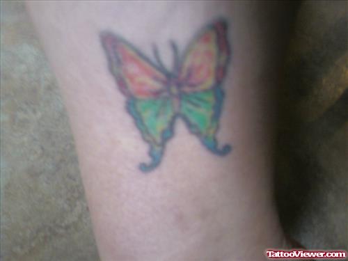 Red And Green Ink Butterfly Tattoo