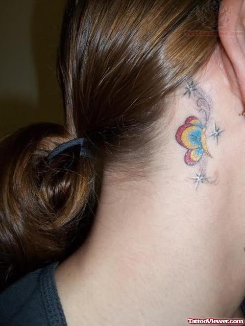 Stars And Color Butterly Tattoo Behind Ear