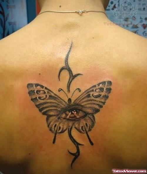 Tribal And Butterfly Tattoo On Back