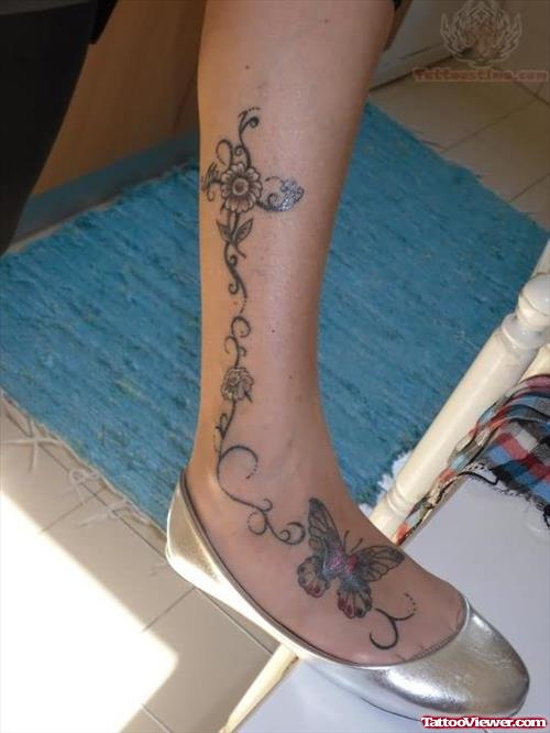 Flower And Butterfly Tattoo On Leg And Foot