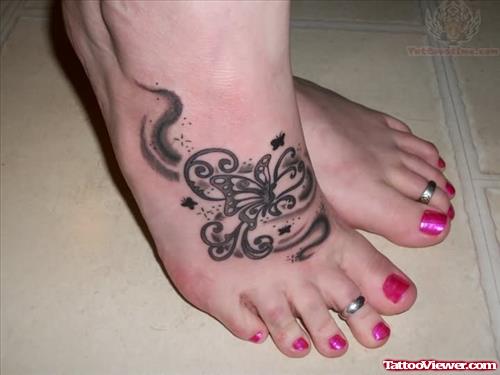 Black Ink Butterfly Tattoo On Foot