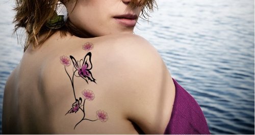Colored Flowers And Flying Butterflies Tattoos On Back Shoulder
