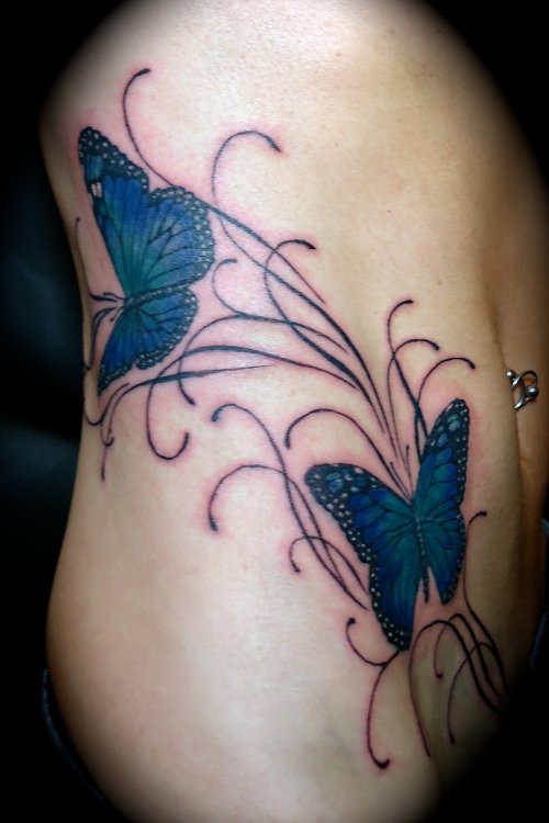 Blue Ink Butterfly Tattoos On Rib Side