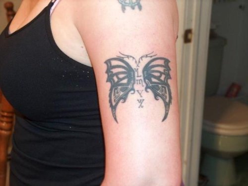 Black Tribal Butterfly Tattoo On Bicep