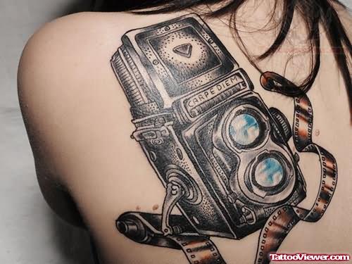 Large Camera Tattoo On Girl Back Shoulder
