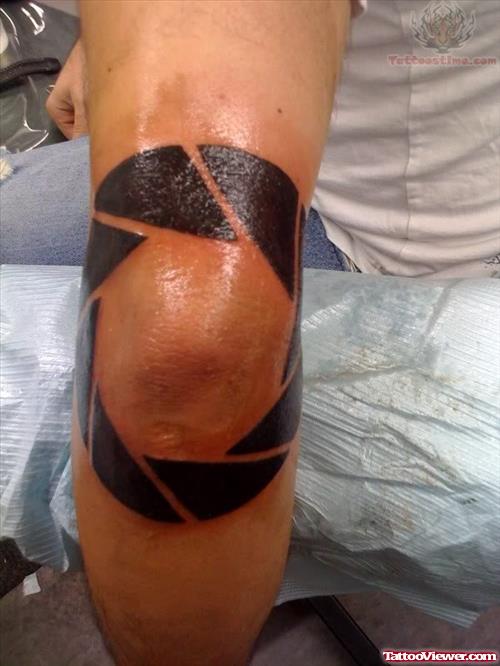 Large Camera Shutter Tattoo On Elbow