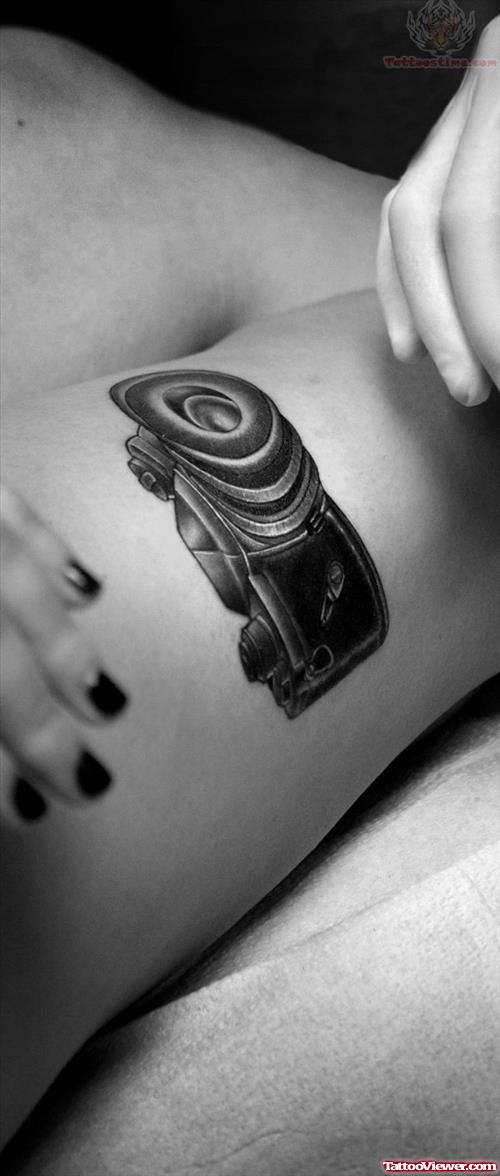 Black Ink Camera Tattoo On Leg