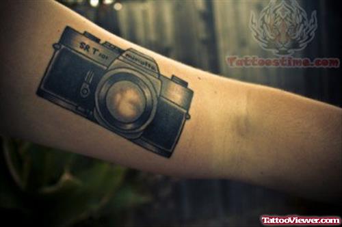Large Camera Tattoo On Bicep